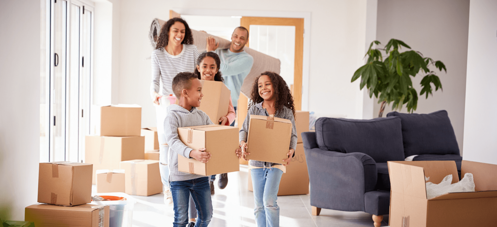 Happy family moving in to their new home thanks to Xpert Home Lending, Inc.